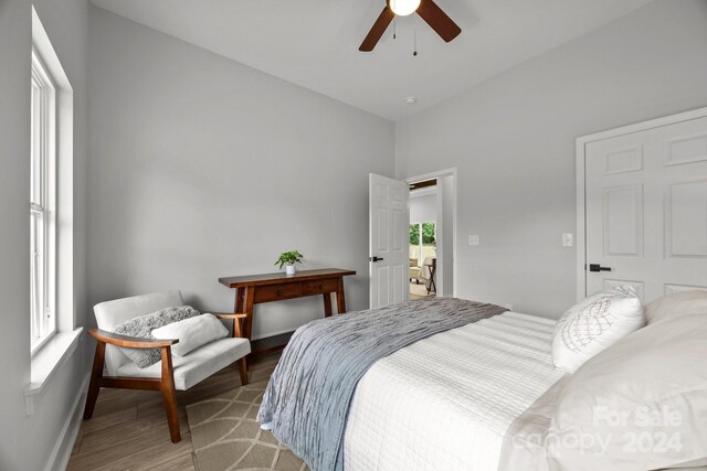 bedroom with ceiling fan and light hardwood / wood-style flooring