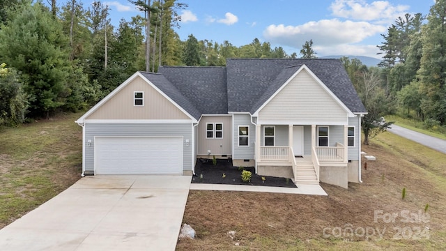 view of front facade featuring a garage and covered porch