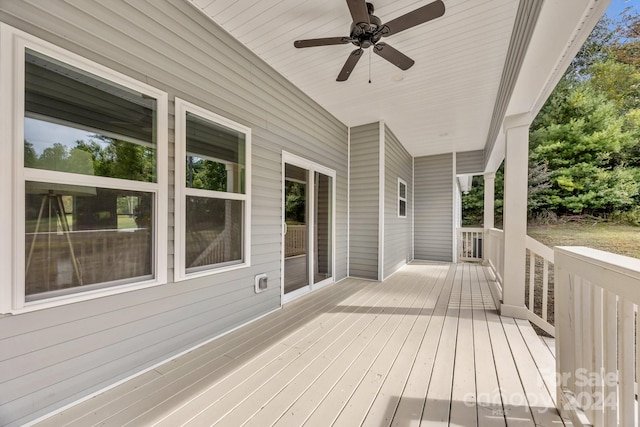 wooden terrace featuring ceiling fan