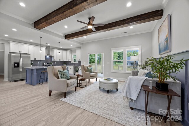 living room with crown molding, light hardwood / wood-style floors, beam ceiling, and ceiling fan