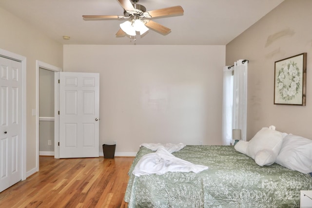 bedroom with ceiling fan and light hardwood / wood-style floors