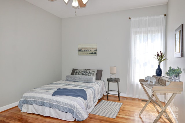 bedroom featuring hardwood / wood-style flooring and ceiling fan