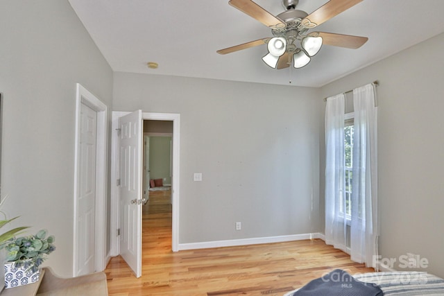 bedroom with ceiling fan and hardwood / wood-style flooring