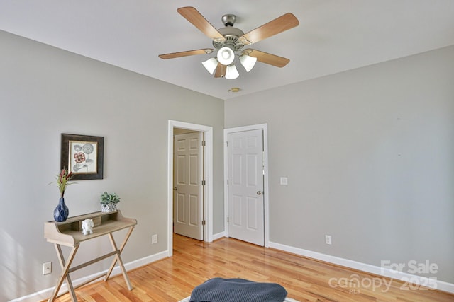 sitting room with ceiling fan and light hardwood / wood-style floors