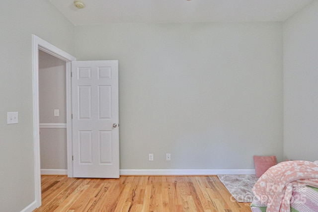 unfurnished bedroom with light wood-type flooring