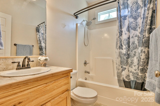 full bathroom featuring vanity, shower / bath combination with curtain, and toilet