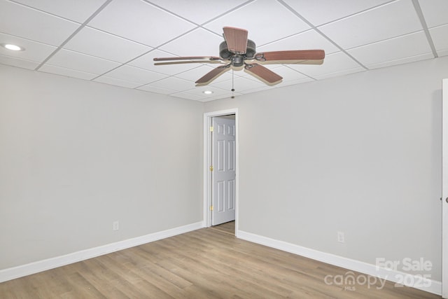 empty room with ceiling fan and wood-type flooring