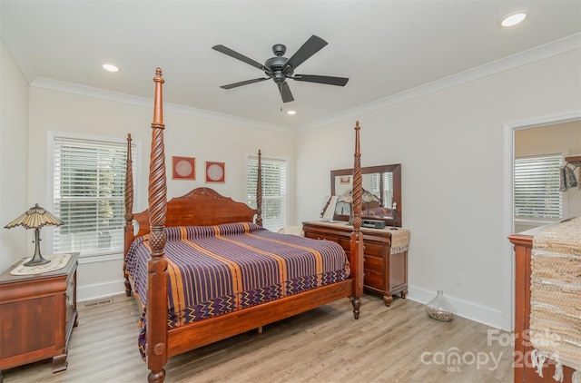 bedroom with ceiling fan, ornamental molding, light wood-type flooring, and multiple windows