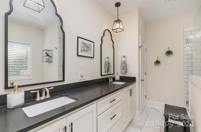 bathroom featuring tile patterned flooring and vanity