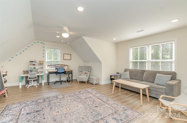 interior space with light hardwood / wood-style flooring, ceiling fan, and vaulted ceiling