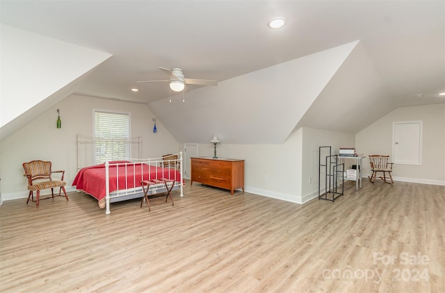 bedroom with light wood-type flooring, lofted ceiling, and ceiling fan