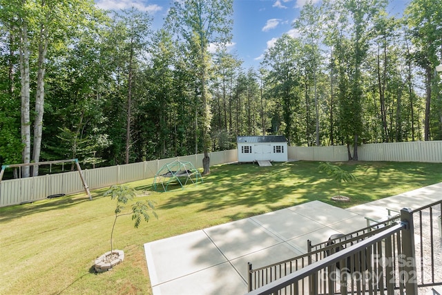 view of yard with a patio area and a storage unit