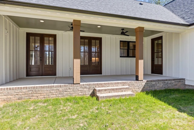 doorway to property with ceiling fan, a patio, french doors, and a lawn