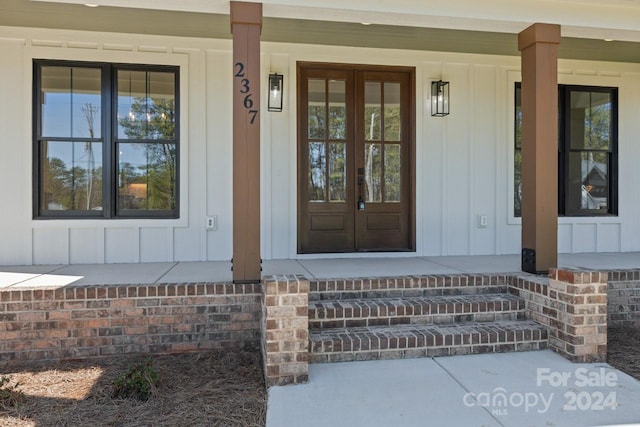 doorway to property with covered porch