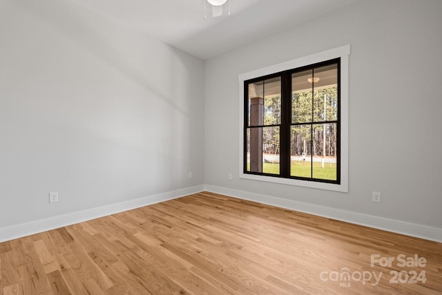 unfurnished room featuring light hardwood / wood-style floors