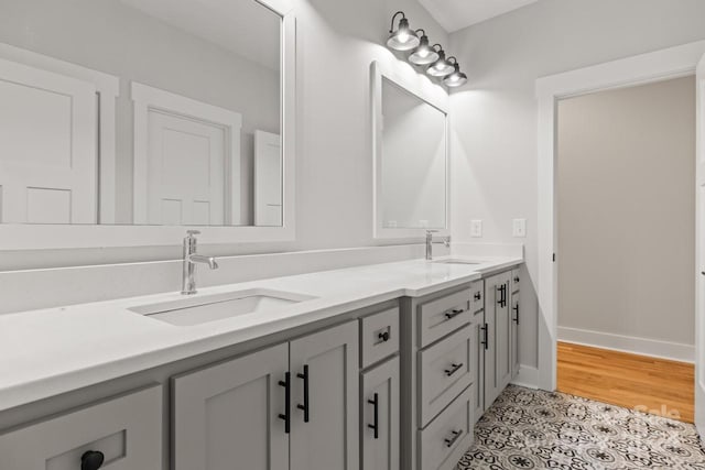 bathroom with tile patterned flooring and vanity