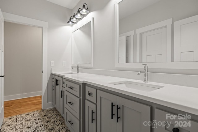 bathroom with tile patterned floors and vanity