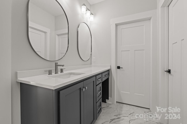 bathroom featuring tile patterned floors and vanity