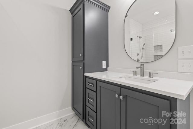 bathroom featuring tile patterned floors, vanity, and walk in shower