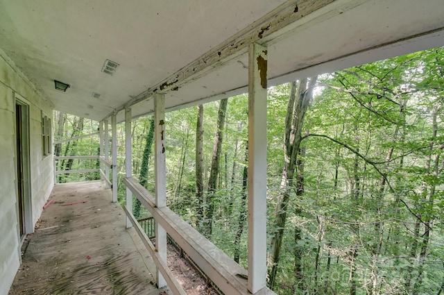 exterior space featuring a forest view