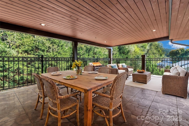 view of patio / terrace featuring an outdoor living space with a fire pit