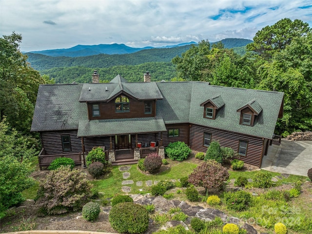 log cabin featuring a mountain view