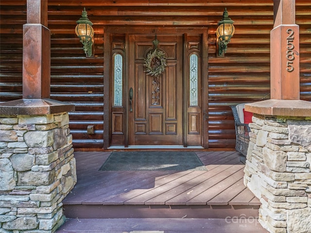 doorway to property featuring a porch