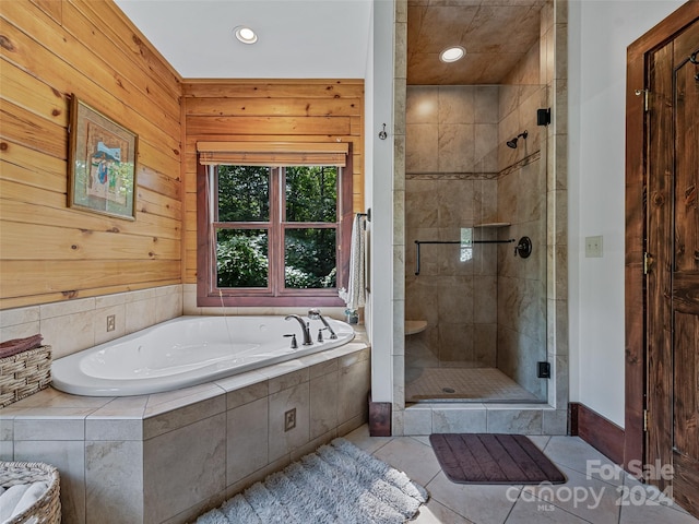 bathroom with tile patterned flooring and plus walk in shower