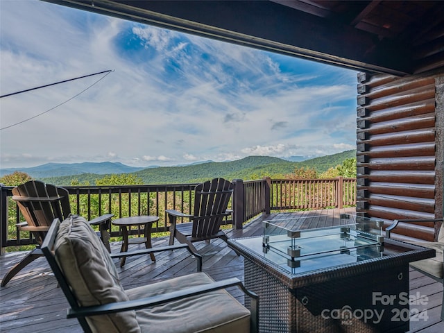 wooden terrace featuring a mountain view