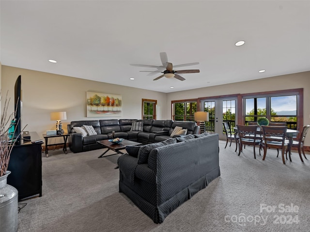 living room featuring ceiling fan, carpet, and french doors