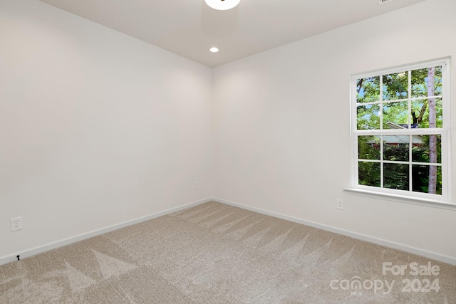 empty room featuring carpet flooring