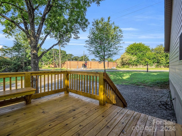 wooden deck with a yard