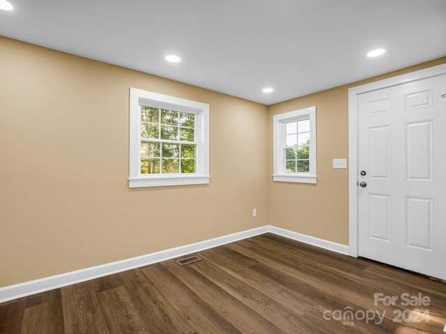 entrance foyer featuring dark hardwood / wood-style floors