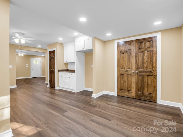 foyer featuring dark wood-type flooring and ceiling fan