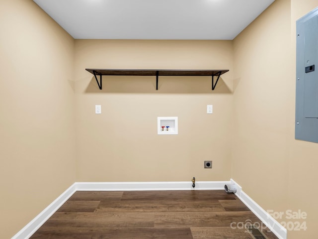 washroom with dark wood-type flooring, hookup for a washing machine, gas dryer hookup, and hookup for an electric dryer