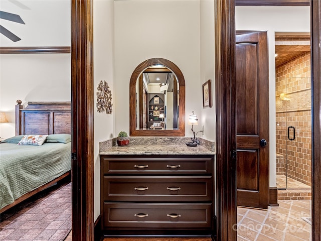 bathroom featuring ornamental molding, vanity, tile patterned floors, an enclosed shower, and ceiling fan