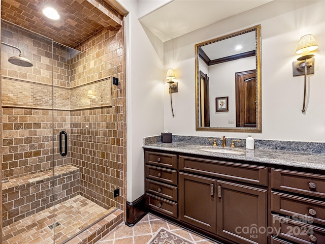 bathroom featuring crown molding, vanity, and walk in shower