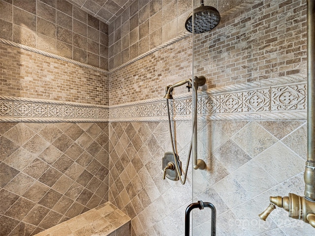 room details featuring a tile shower