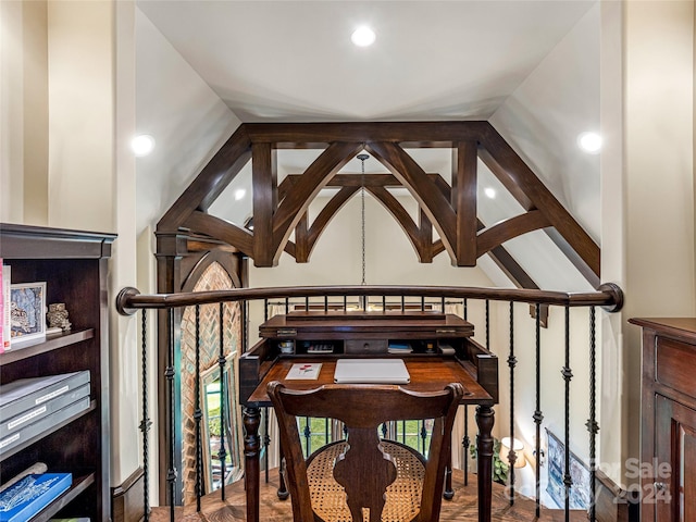 interior space featuring vaulted ceiling, wood-type flooring, and plenty of natural light