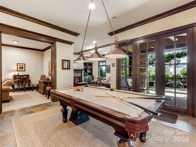 game room with billiards, plenty of natural light, french doors, and light tile patterned floors