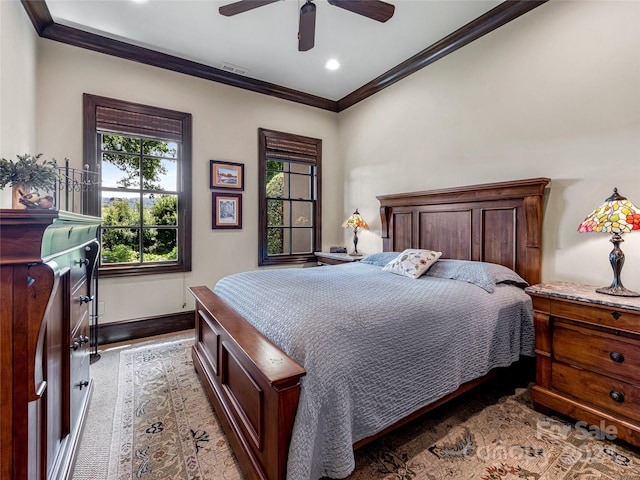 bedroom featuring ceiling fan and crown molding