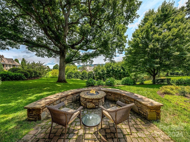 view of patio / terrace with an outdoor fire pit