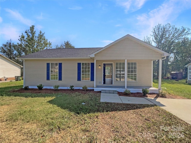 ranch-style house with a front lawn and covered porch