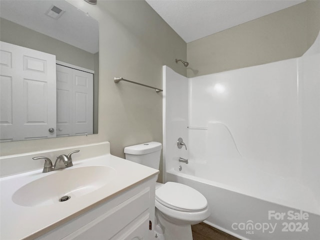 bathroom featuring toilet, visible vents, vanity, a closet, and washtub / shower combination