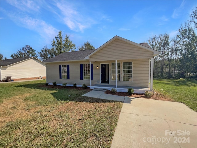 view of front of house featuring a front lawn and a porch