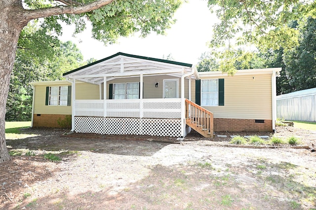 manufactured / mobile home with crawl space and covered porch