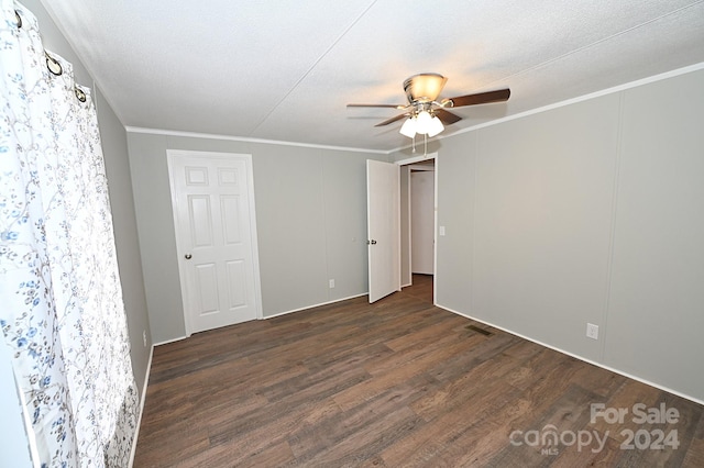 unfurnished room with visible vents, crown molding, a textured ceiling, and wood finished floors