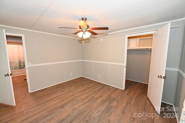 unfurnished bedroom with a closet, a textured ceiling, ceiling fan, and wood finished floors