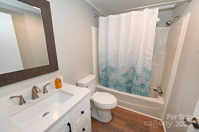 bathroom with wood finished floors, vanity, toilet, and shower / bath combo with shower curtain