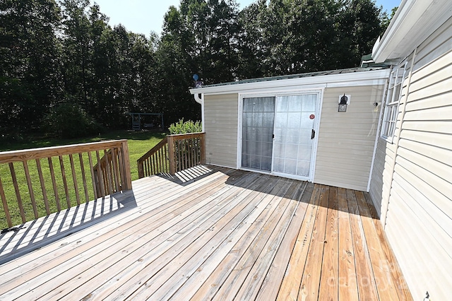 wooden terrace with a yard